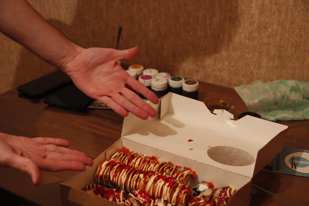 Corporate gift box of artisan doughnuts being opened