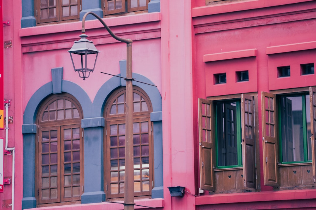 Doughnut Shack storefront with pink door and spinning doughnut sign
